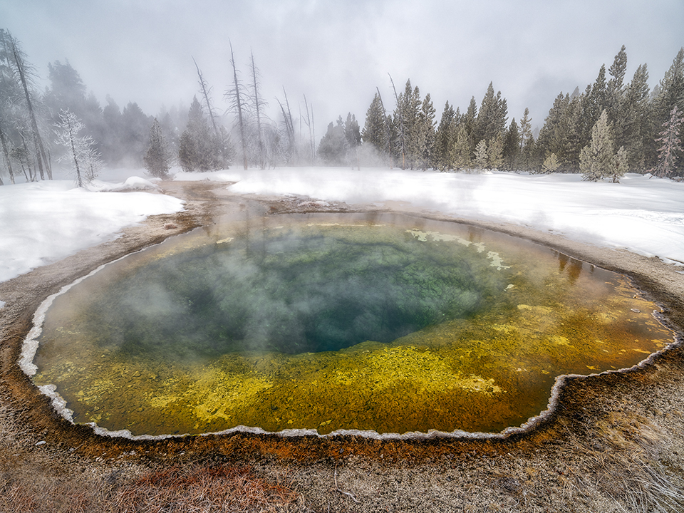A winter view of Morning Glory Pool, Upper Geyser Basin, Yellowstone National Park / Rebecca Latson
