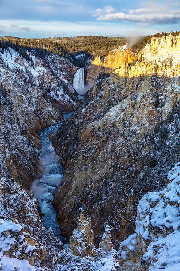A freezing autumn sunrise over the Lower Falls, Yellowstone National Park / Rebecca Latson