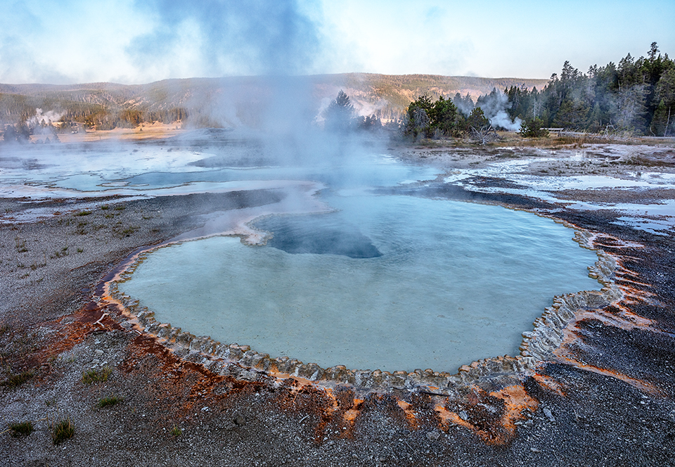 A steaming Doublet Pool, Upper Geyser Basin, Yellowstone National Park / Rebecca Latson A steaming Doublet Pool, Upper Geyser Basin, Yellowstone National Park / Rebecca Latson