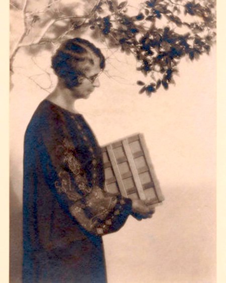 A black and white photo of Ynes Mexia with her plant dryer under a tree University of California Berkley