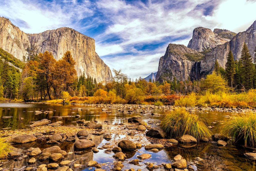 The placid Merced, colorful forests, and Half Dome in the distance help define fall in Yosemite/Yosemite Scenic Wonders
