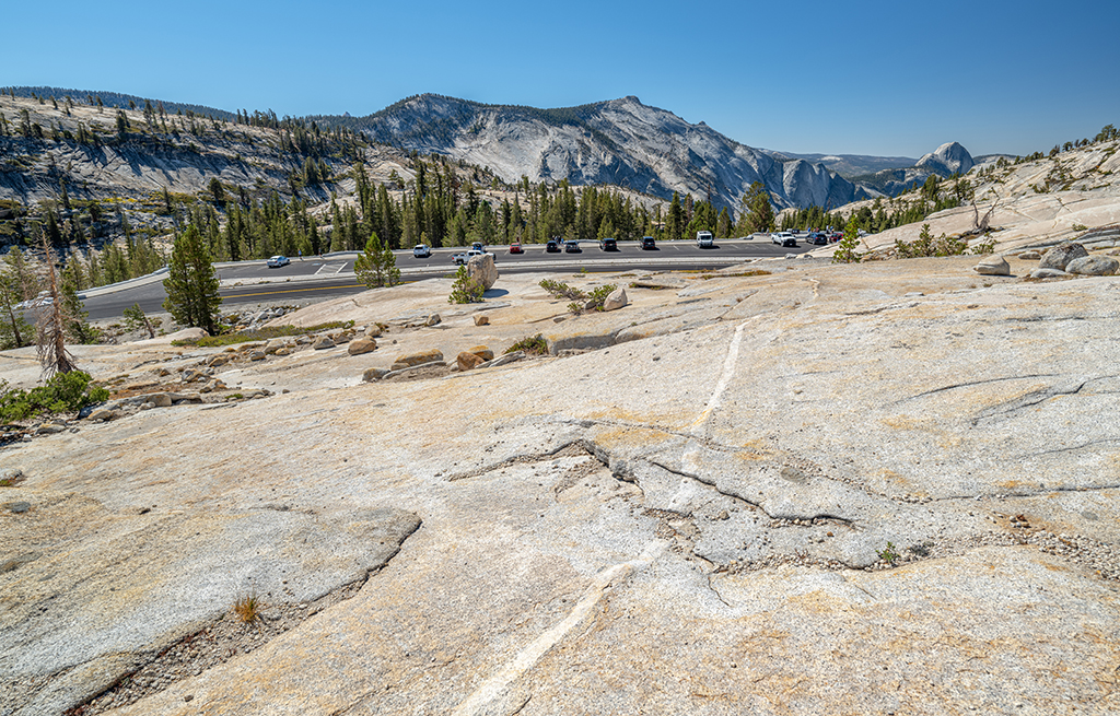 Olmsted Point is a great place to stop and take in the granite Sierras as well as distant views of the landscape, including Half Dome, Yosemite National Park / Rebecca Latson Olmsted Point is a great place to stop and take in the granite Sierras as well as distant views of the landscape, including Half Dome, Yosemite National Park / Rebecca Latson