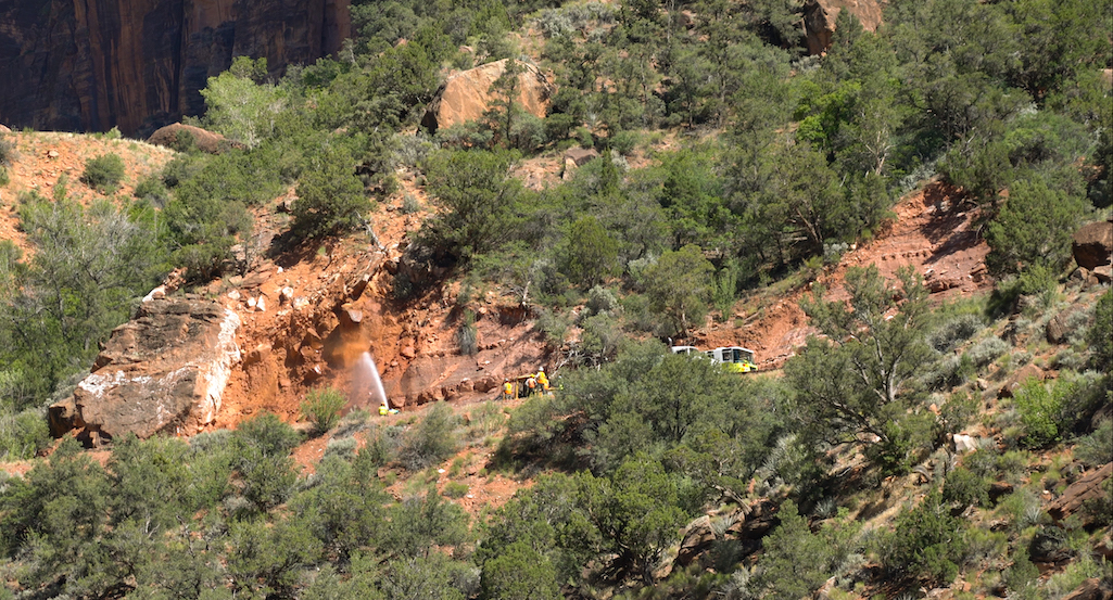 Zion National Park crews used water to knock down loose rocks on a hillside above the Zion-Mount Carmel Highway/NPS Zion National Park crews used water to knock down loose rocks on a hillside above the Zion-Mount Carmel Highway/NPS