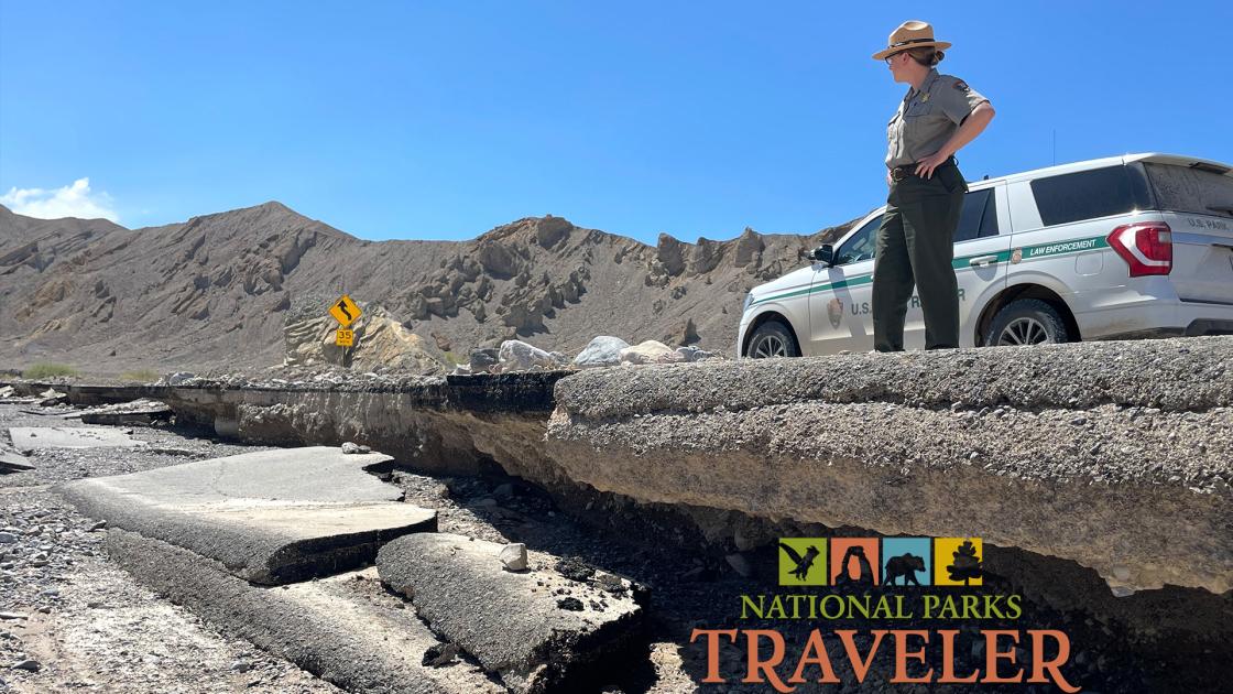 A park ranger inspects road damage from flooding at Death Valley National Park