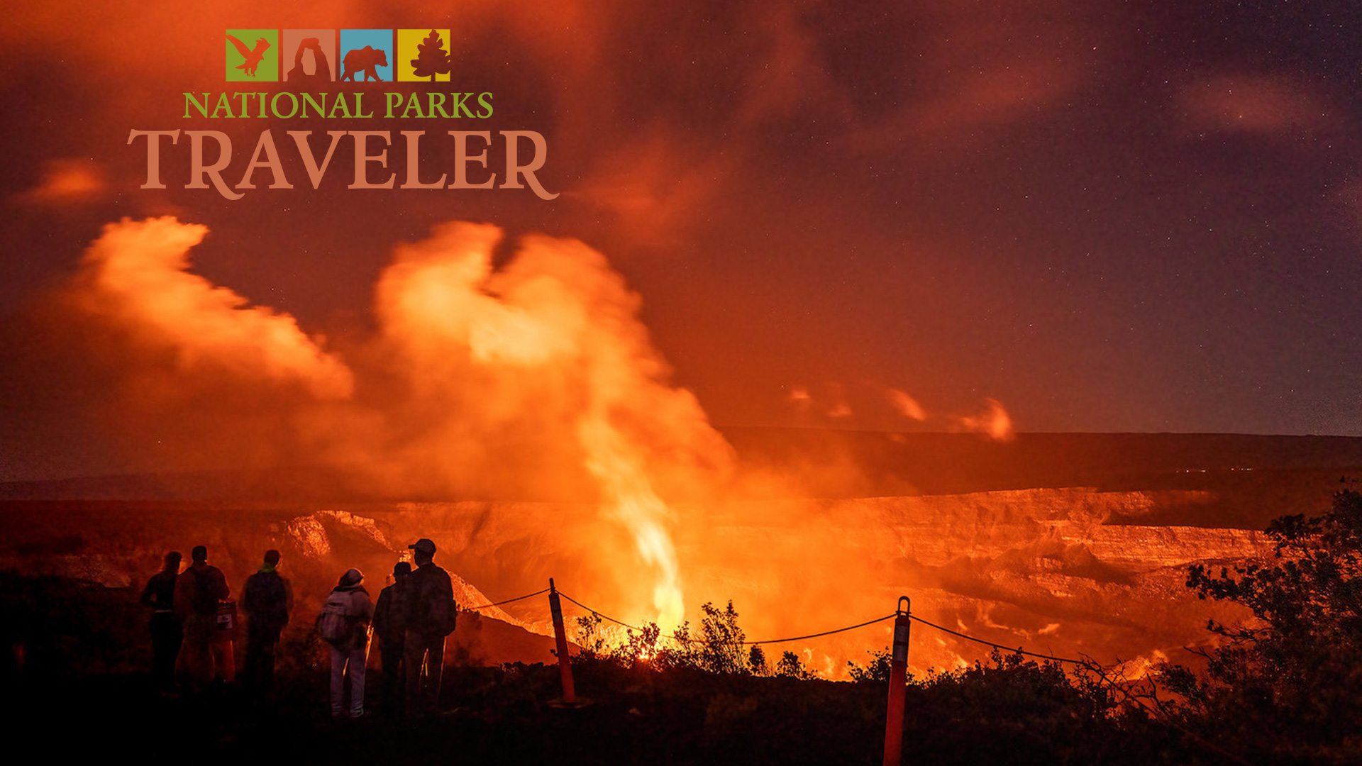 A crowd watching a night time volcano eruption at Hawaii Volcanoes National Park