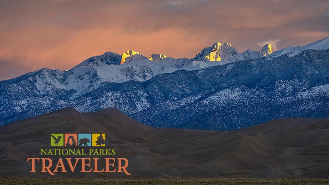 A telephoto sunrise over the mountains at Great Sand Dunes National Park by Rebecca Latson