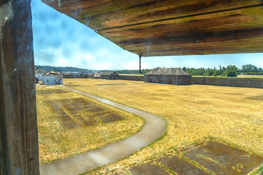 A view from a somewhat spotted window of the Bastion looking out onto the grounds of Fort Vancouver National Historic Site.