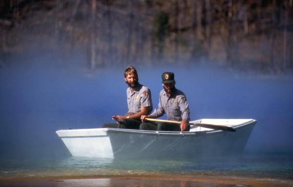 Geologists in Little Dipper boat on Grand Prismatic Spring