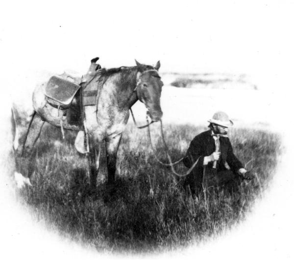 Geologist Ferdinand Hayden at work with a rock hammer in 1870