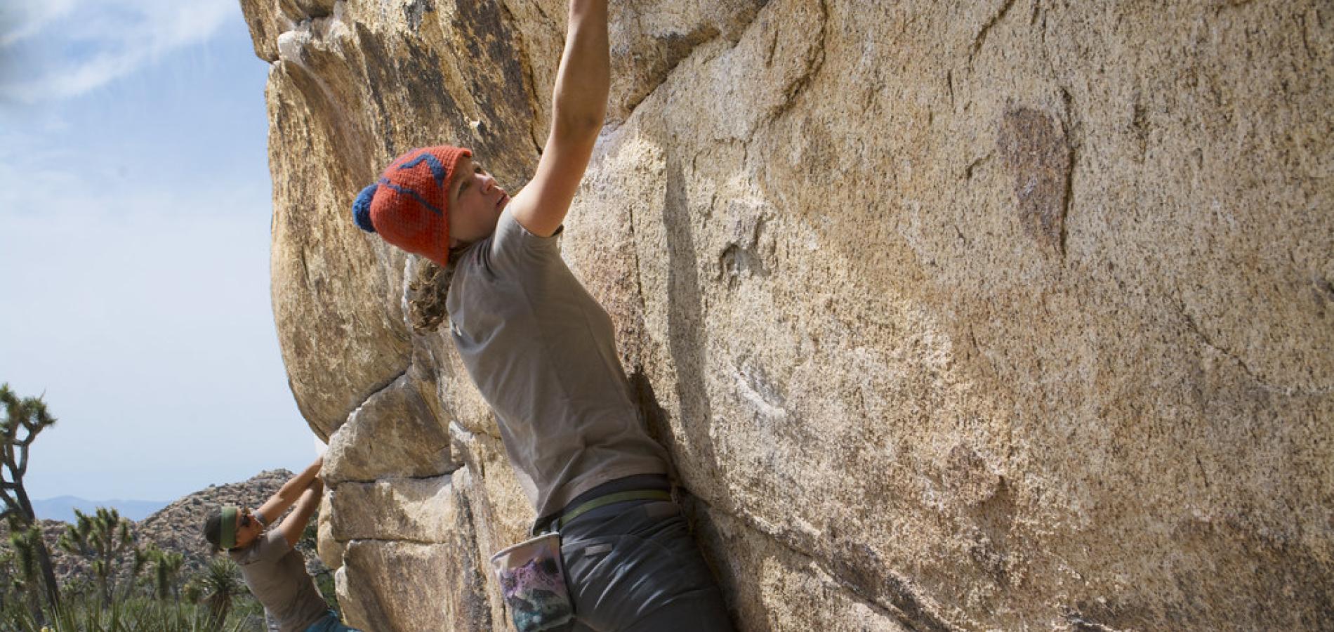A woman boulders at Joshua Tree National Park.