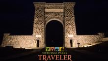 A night time image of the Roosevelt Arch in Yellowstone National Park