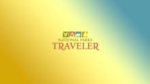 The Traveler logo on a blue and orange gradient background