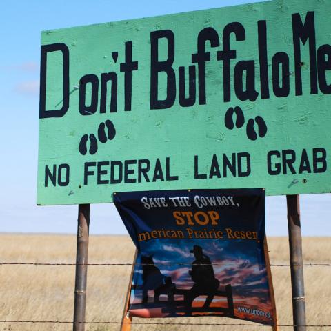 Open prairie landscape with a sign that says "Don't Buffalo Me. No federal land grab!". Photo by Kurt Repanshek.