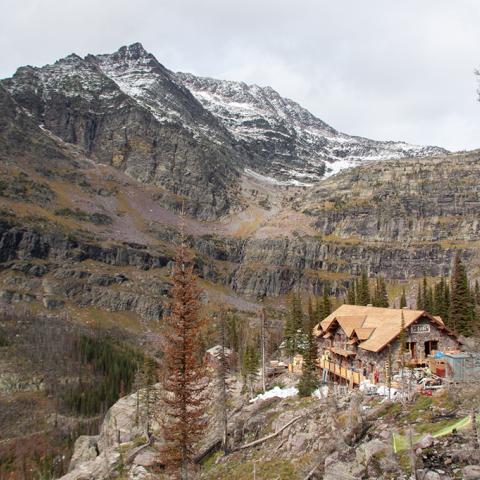Chalet building on a cliff in a mountain range, Glacier National Park