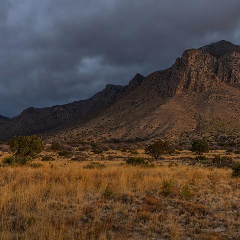 A golden sunrise over a moody morning at Guadalupe Mountains National Park