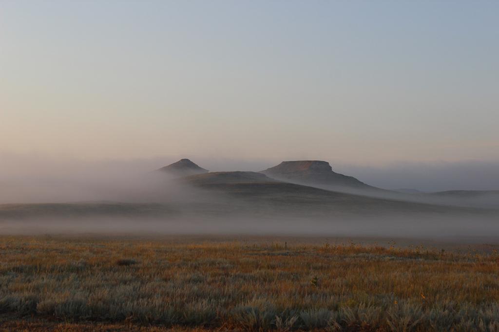 Two distant hills shrouded in fog, Agate Fossil Beds National Monument