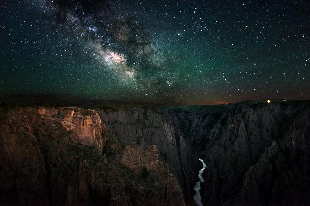 A dark sky with a bright Milky Way over the Black Canyon of the Gunnison National Park