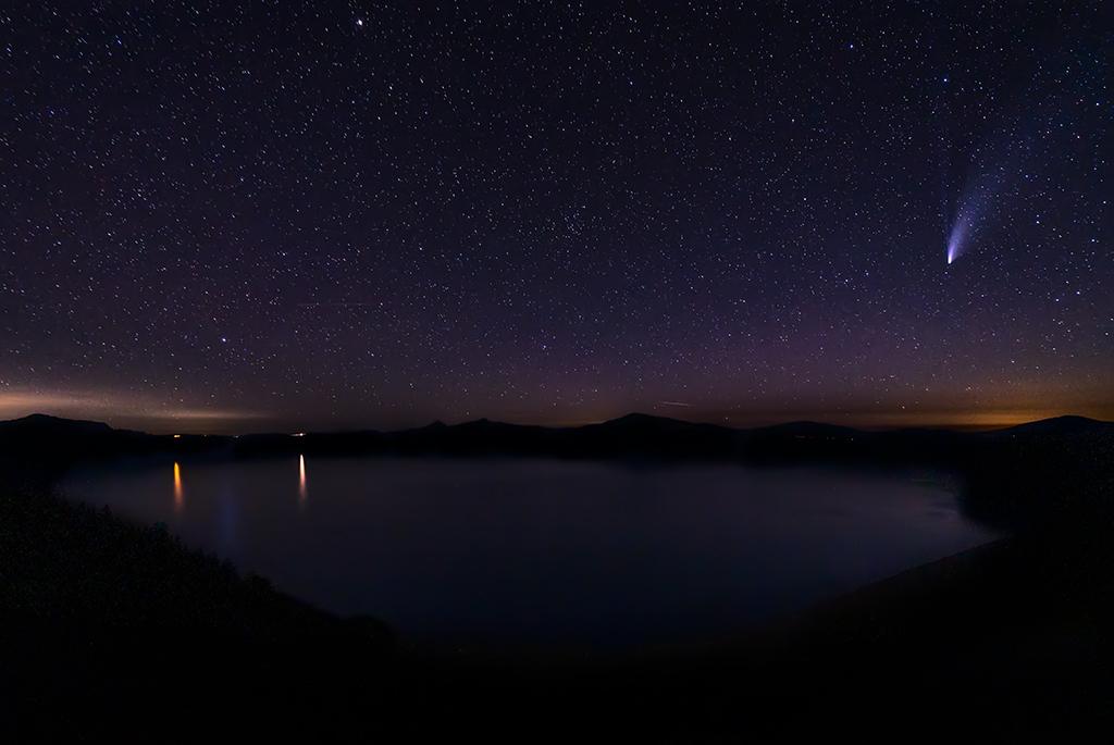 Neowise comet in a starry summer sky over Crater Lake National Park