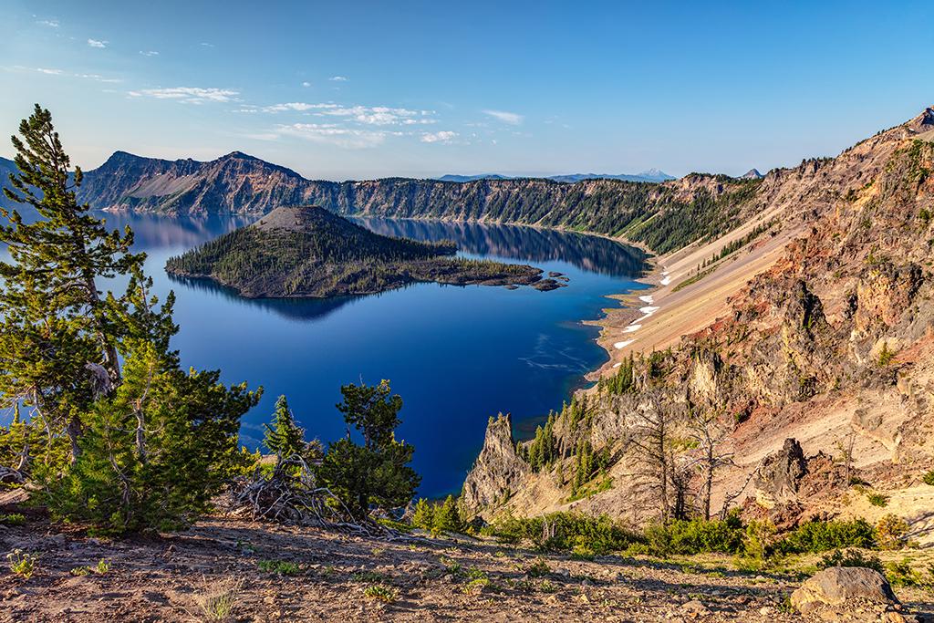 A view of wizard island and deep blue lake water at Crater Lake National Park