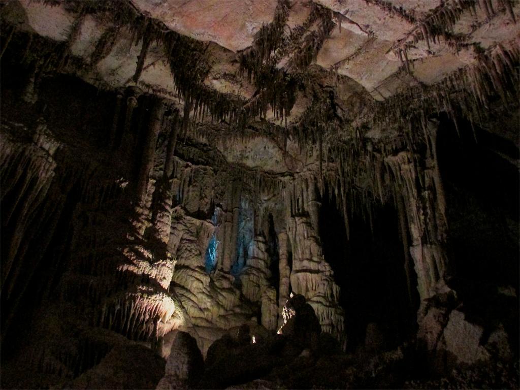 A dim interior view of cave formations in Lehman Caves at Great Basin National Park