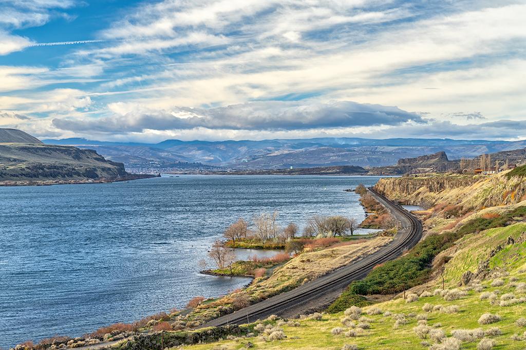 A downriver view of the Columbia River, with Oregon on the left, Washington state on the right, and Horsethief Butte in the far center right all along the Lewis and Clark National Historic Trail