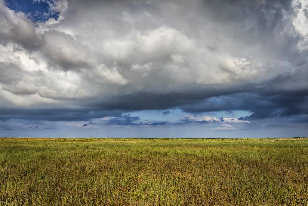 A stormy day over a prairie grass landscape at Padre