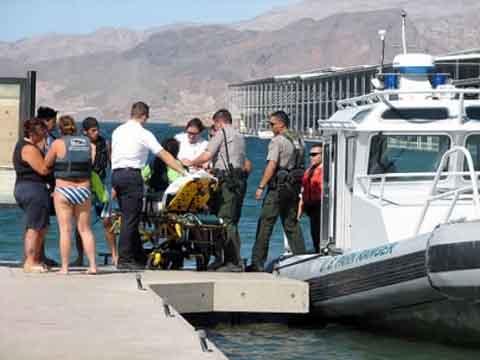 Rescued boaters arriving on shore.