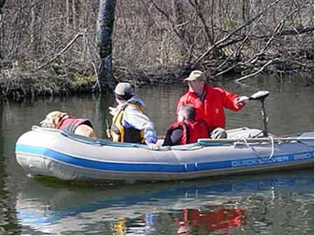 searchers in boat.