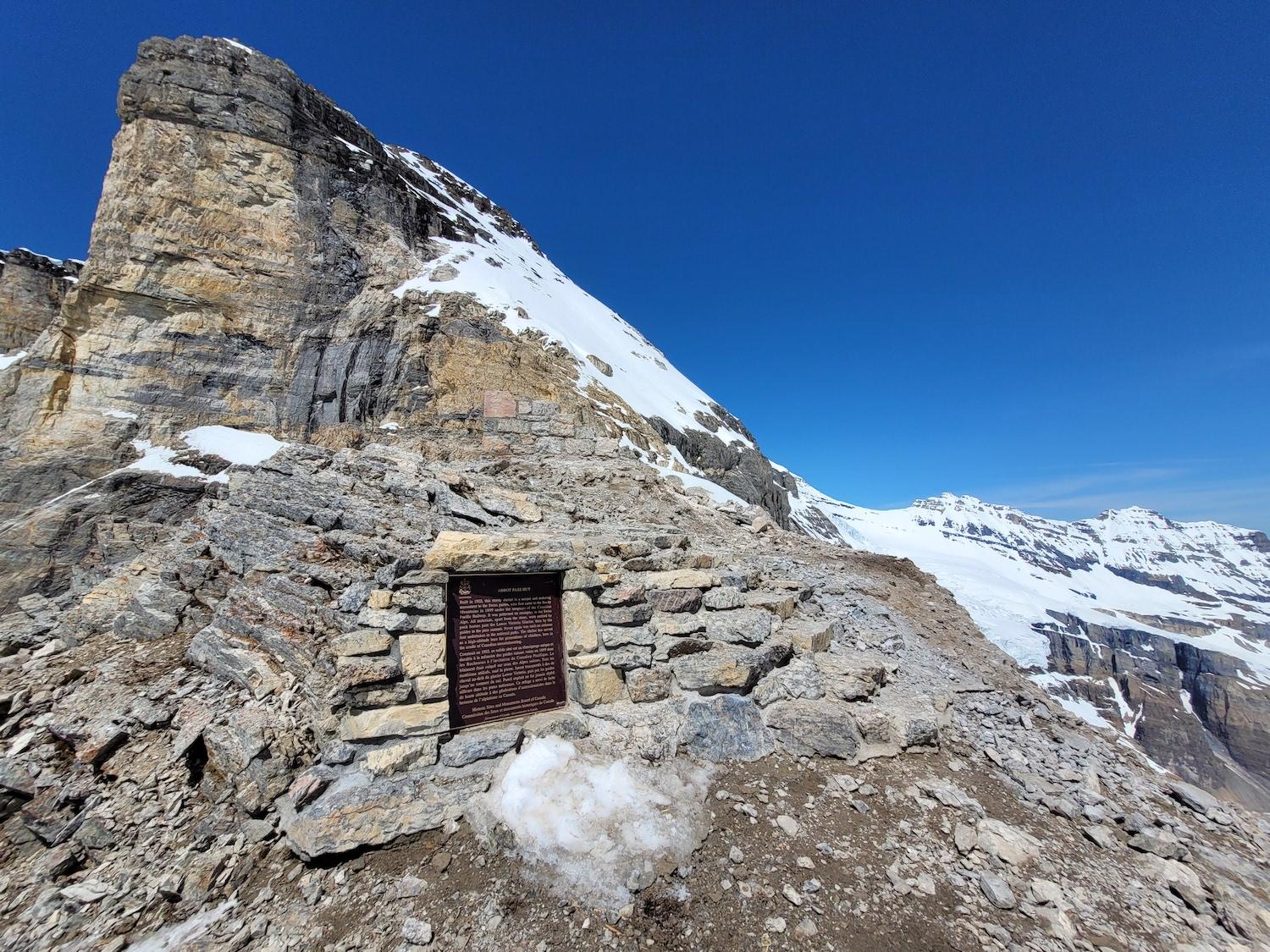 In 2022, most of the iconic stone shelter known as Abbot Pass Hut was removed. 
