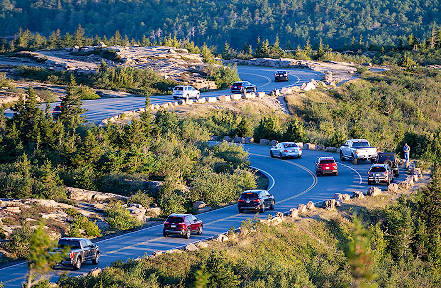 Cars drive down the Cadillac mountain road after viewing the sun rise in Acadia National Park. (Photo by Will Newton/Friends of Acadia)