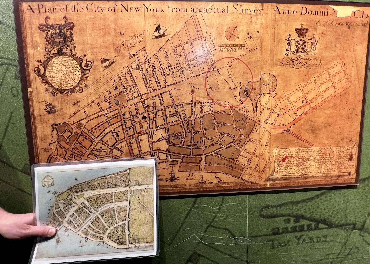A 1755 map shows the "Negros Buriel Ground" circled in red. The smaller picture shows how what's now the tip of Manhattan Island was protected by a wall.