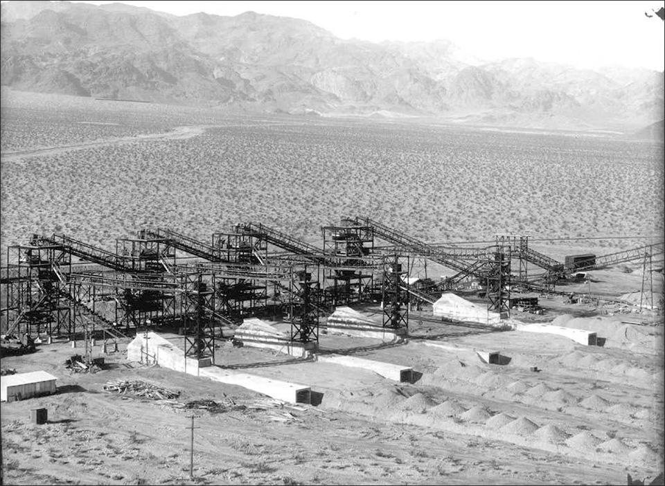 Overview of Aggregate Classification Plant under construction, 11/01/1931. Main railroad line from vicinity of present marina area is visible in background. Concrete structures will provide access to conveyors after gravel piles form. Tower 4 is at left a