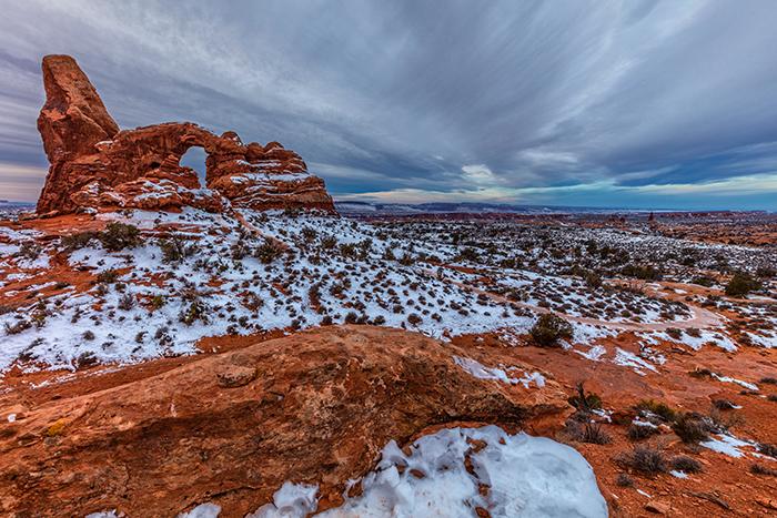 A moody morning over Turret Arch, Arches National Park / Rebecca Latson