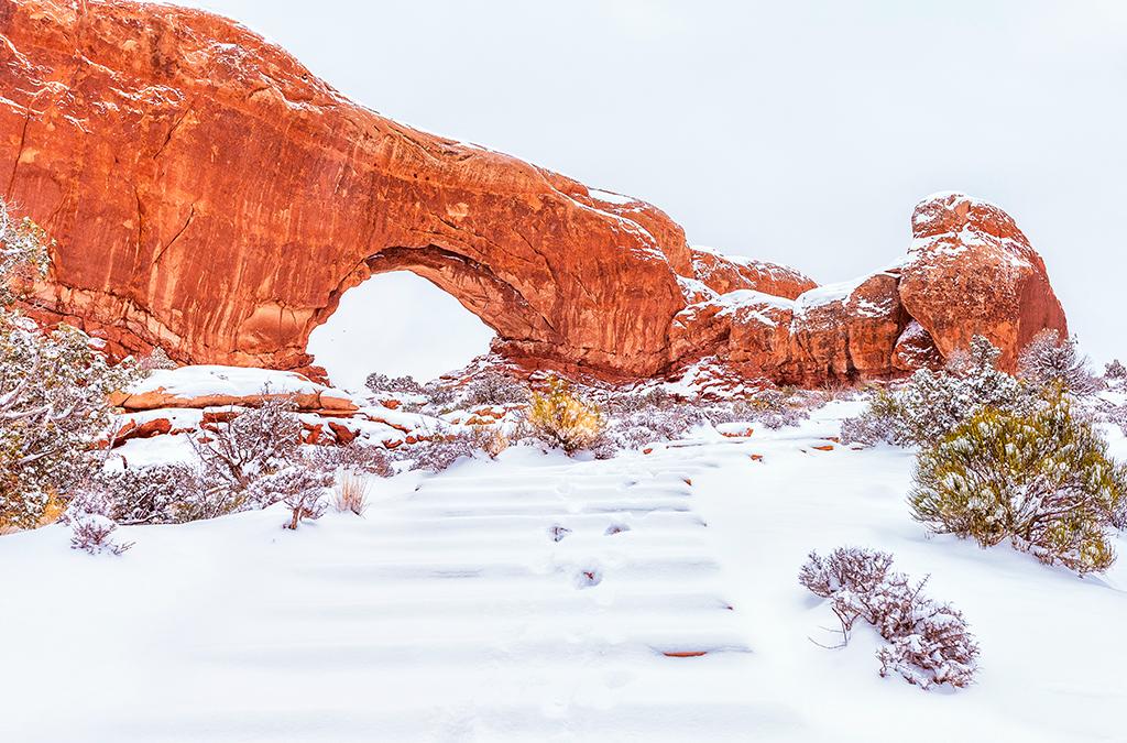 Snowy steps up to the North Window, Arches National Park / Rebecca Latson