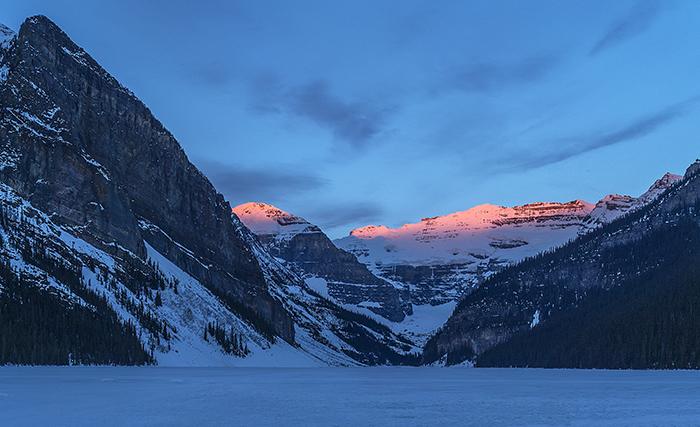 Morning Alpenglow Over Lake Louise - Crop, Banff National Park / Rebecca Latson