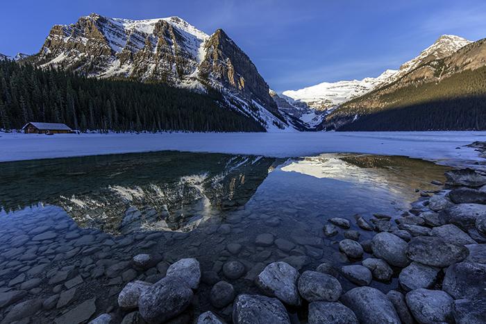 Sunrise Reflections At Lake Louise, Banff National Park / Rebecca Latson