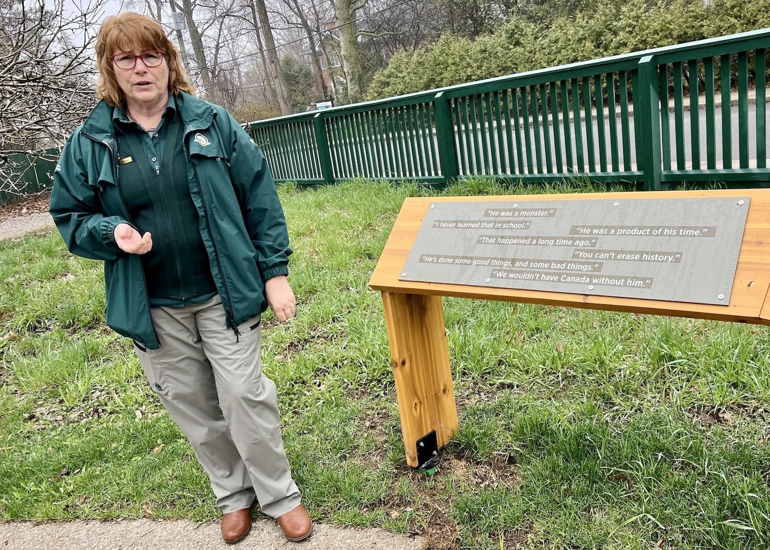 Parks Canada's Tamara van Dyk, historic sites and visitor experience manager, shows off new signage at Bellevue House.