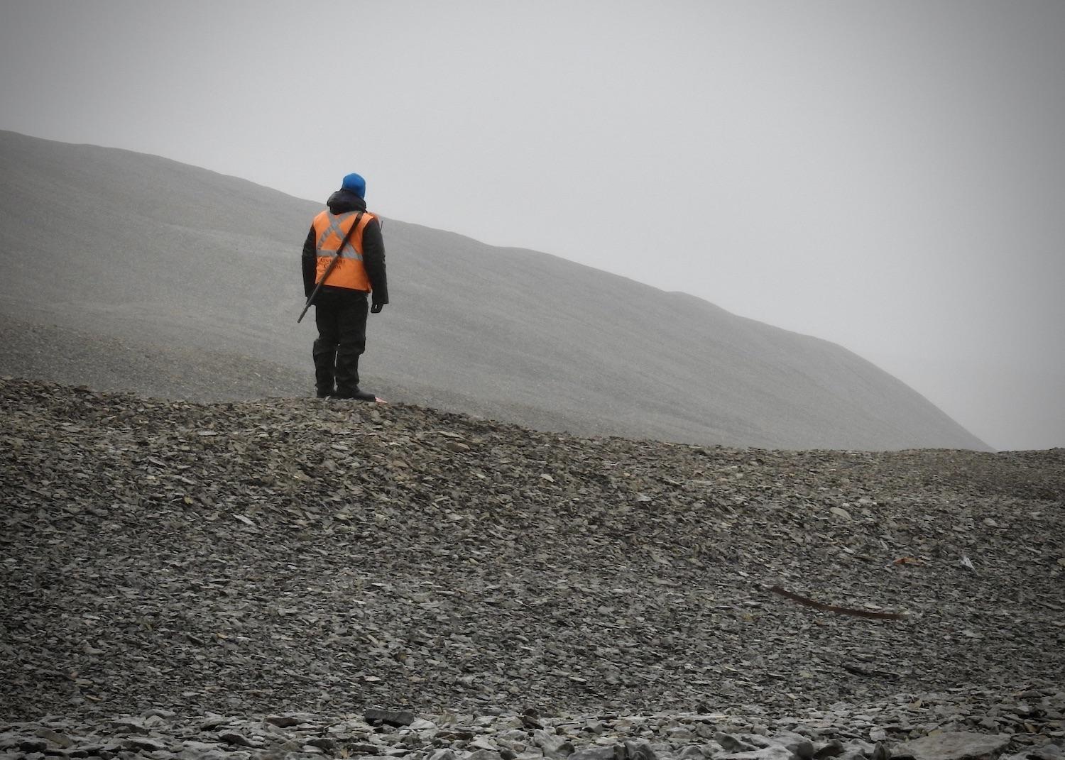 A bear guard stands watch at Beechey Island Sites National Historic Site in Nunavut.