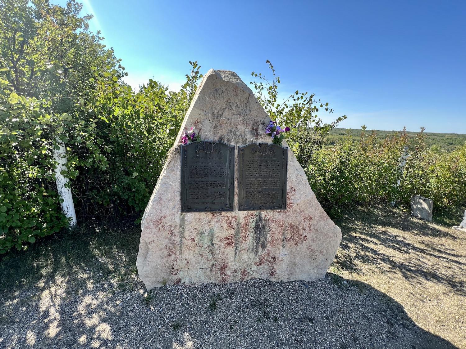 The magnificent rock and plaque that marks the final resting place of Gabriel Dumont, a prominent leader of the Métis people.