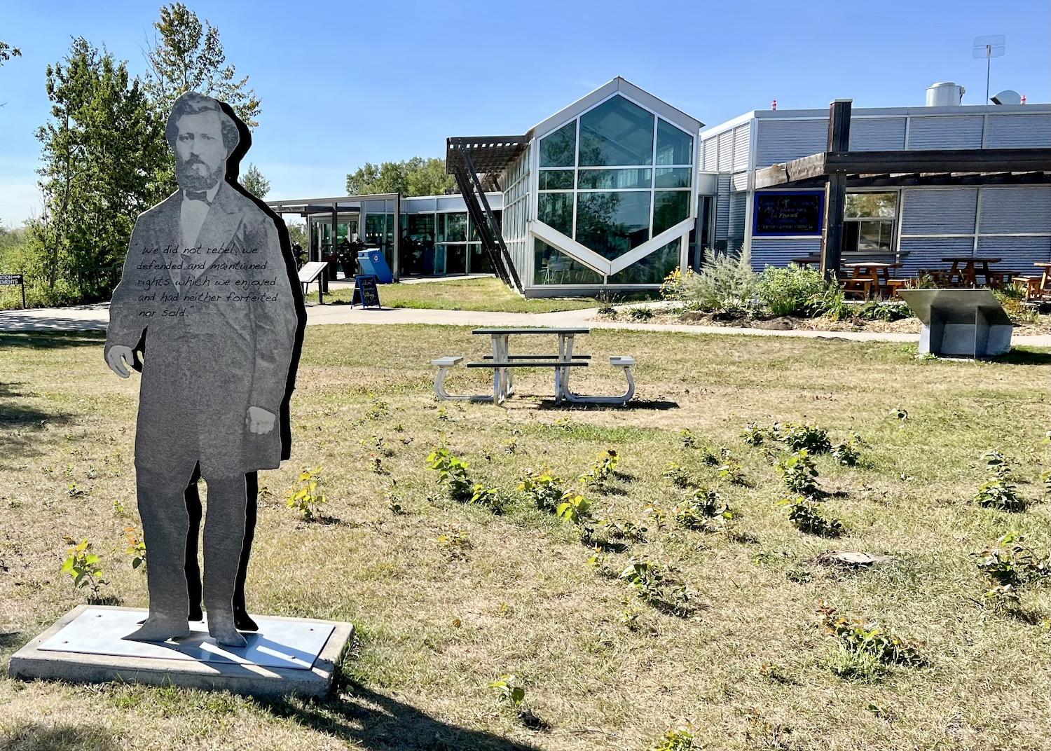 An image of Métis leader Louis Riel, emblazoned with one of his famous quotes, greets visitors to Batoche.