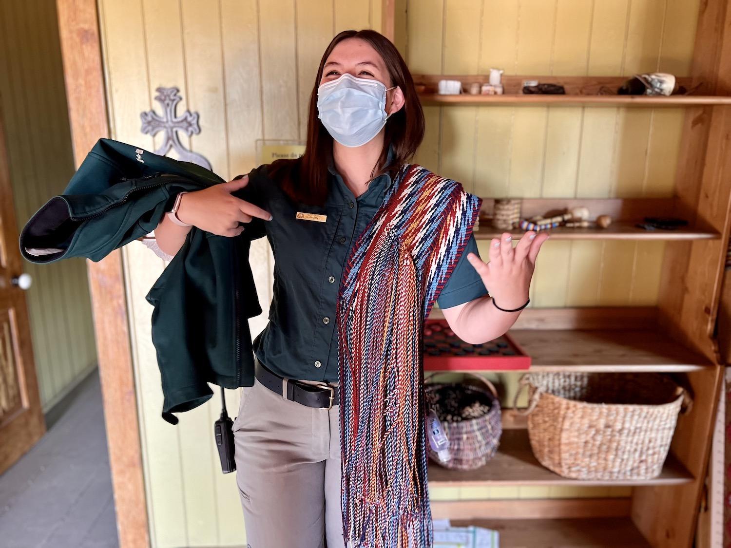 Parks Canada heritage interpreter Jacelyn Perret shows the many uses of the traditional Métis sash while on a tour of Batoche National Historic Site.