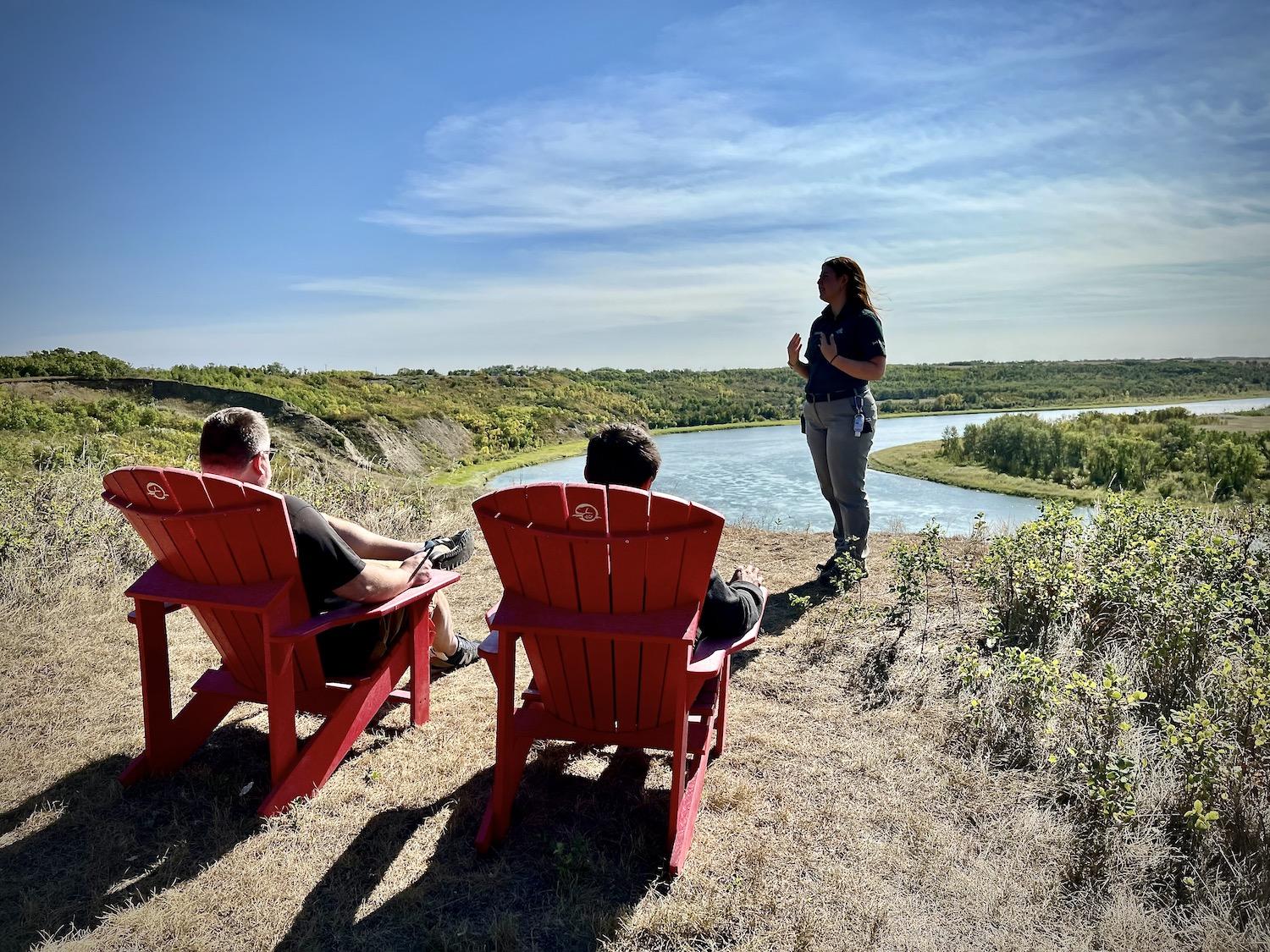 Sit in these Parks Canada red chairs for views of the South Saskatchewan River.