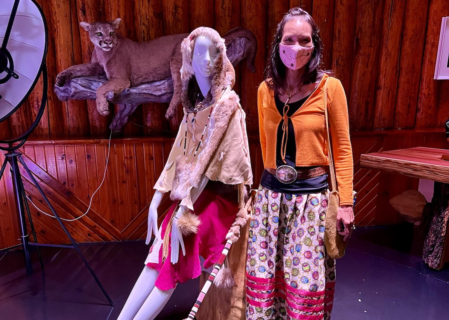 In the contemporary area of the Buffalo Nations Museum in Banff, artist Tania Big Plume shows off some of her clothing designs.