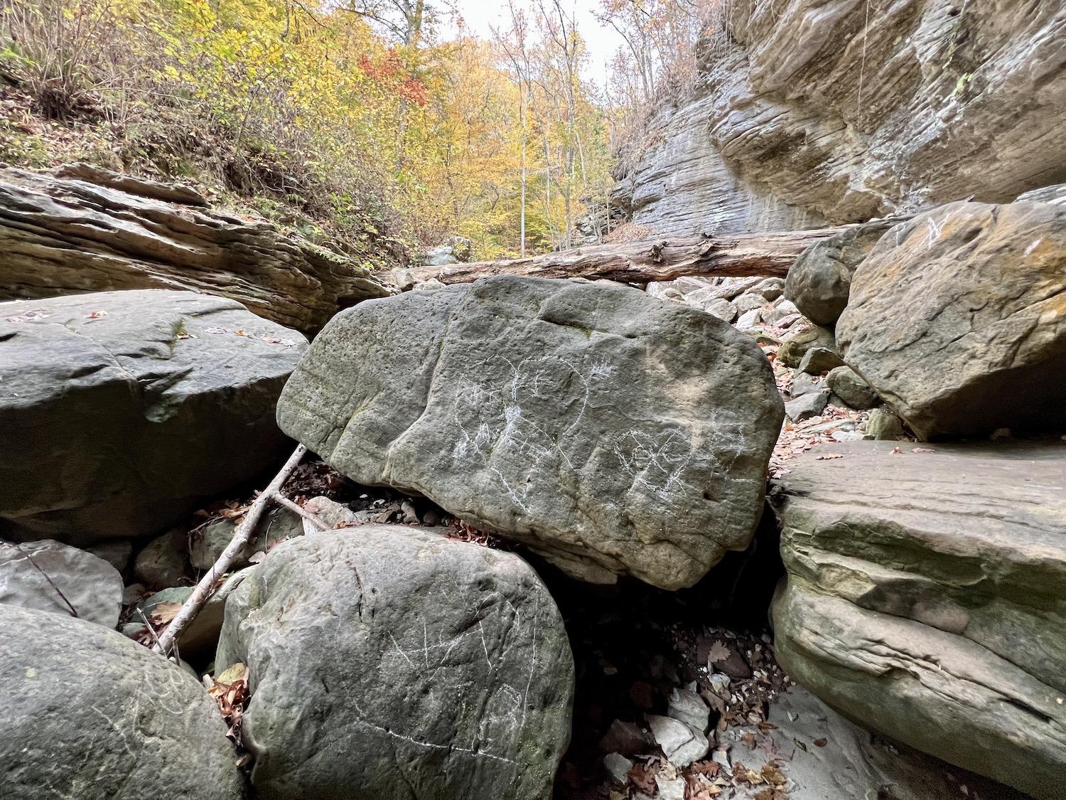 People are still compelled to scrawl graffiti in the Buffalo National River, although it's illegal.