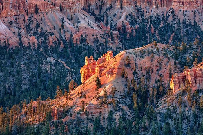 A telephoto view of sunlight on a distant cliff face, Bryce Canyon National Park / Rebecca Latson