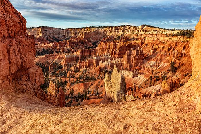 A rock wall frame to the scenery beyond, Bryce Canyon National Park / Rebecca Latson