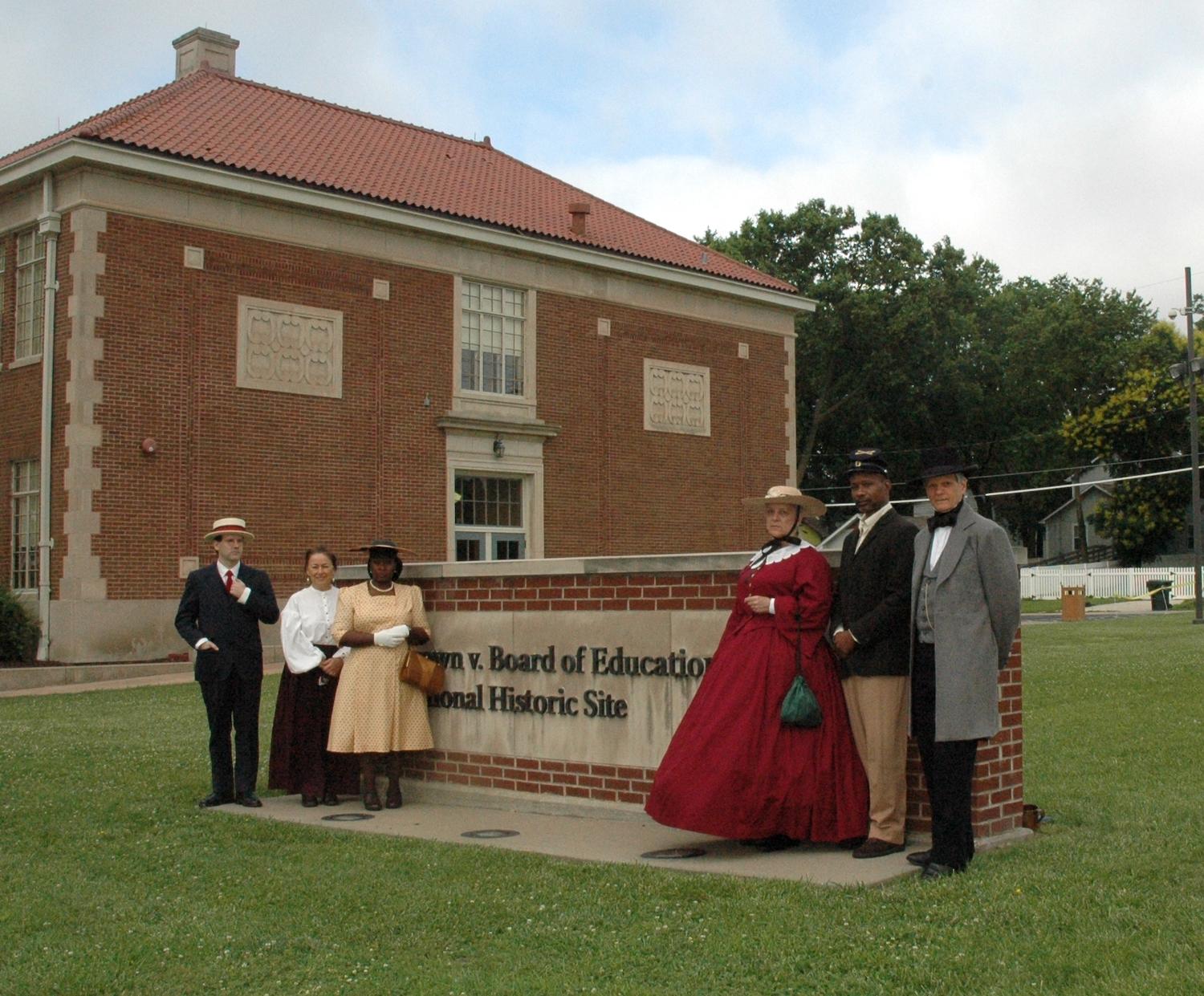 At Brown v. Board of Education National Historic Sites, there are living history walks that feature six re-enactors portraying characters from 1854 to 1954 and linked neighborhood stories to national stories of Civil War and civil rights/NPS