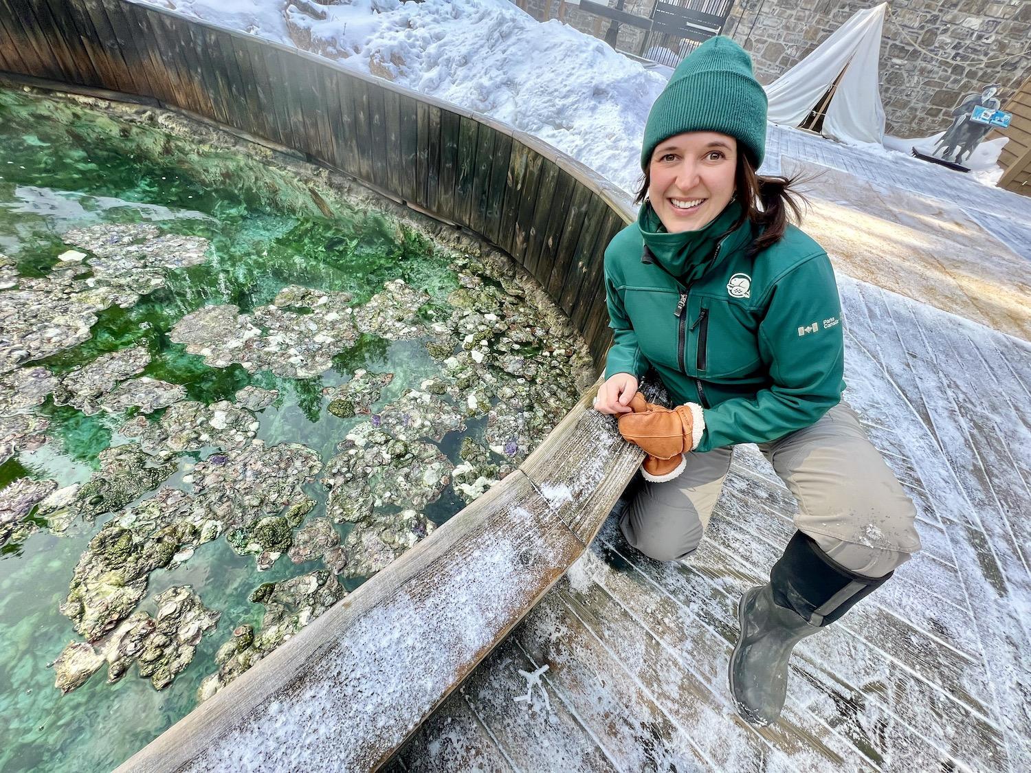 Kate Keenan, a resource conservation officer with Parks Canada, is shown at "the Basin" at Cave and Basin National Historic Site in Banff National Park. It's home to endangered Banff Springs Snails.