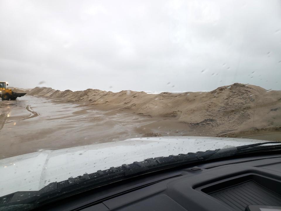 North Carolina road crews were out Wednesday morning removing sand from Highway 12 that runs through Cape Hatteras National Seashore/NCDOT