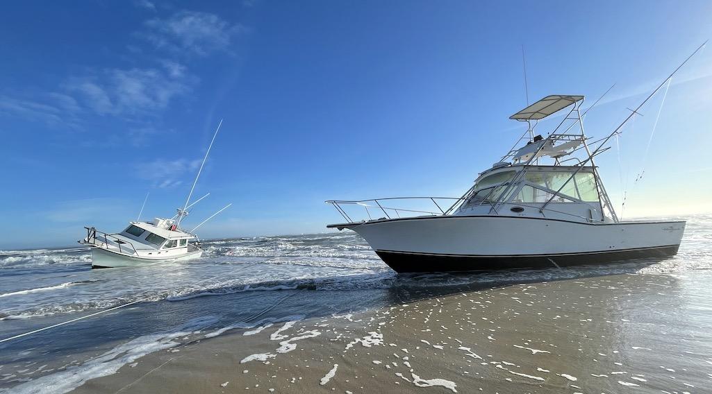 Pictured, from left, Reel Lucky and Bite Me sit grounded on the beach near Oregon Inlet on Feb. 3, 2022. NPS photo